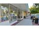 A quaint street view with storefronts, awnings, and sidewalk seating, perfect for enjoying the local scene at 271 Manor Rd, Venice, FL 34293