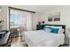 The bedroom is bright, with a large window with shades and tile floors at 3006 Caring Way # 304, Port Charlotte, FL 33952
