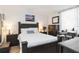A cozy bedroom featuring a large bed, wooden furniture, and a bright, airy feel at 3006 Caring Way # 304, Port Charlotte, FL 33952