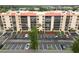 Modern condo building featuring multiple balconies and well-maintained landscaping at 3006 Caring Way # 304, Port Charlotte, FL 33952
