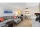 Comfortable living space with tile flooring, ample seating, dining area, and bright natural light at 3006 Caring Way # 304, Port Charlotte, FL 33952