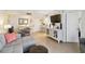 Open-concept living space with dining area, counter seating, tile floors, and a neutral color palette at 3006 Caring Way # 304, Port Charlotte, FL 33952