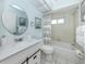 Well-lit bathroom featuring a modern vanity, shower-tub combo, and coordinated decor at 3167 Night Heron Ln, Venice, FL 34293