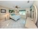 Cozy bedroom with tile flooring, ceiling fan, and serene decor at 3167 Night Heron Ln, Venice, FL 34293