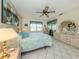 Inviting bedroom with ceiling fan, tile flooring, and closet access at 3167 Night Heron Ln, Venice, FL 34293