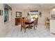 Comfortable dining room with wood furnishings, decorative accents, and a view to the exterior at 3167 Night Heron Ln, Venice, FL 34293