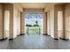 An enclosed balcony area with a view of the greenery of the golf course on a sunny day at 3337 Pine Shadow Cir, North Port, FL 34287