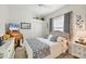 Cozy bedroom with ample natural light, closet, and stylish decor at 3337 Pine Shadow Cir, North Port, FL 34287