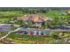 The clubhouse exterior overlooks the golf course, featuring manicured landscaping and ample parking at 3337 Pine Shadow Cir, North Port, FL 34287