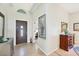 Bright entryway featuring a decorative glass door and tiled floors at 3337 Pine Shadow Cir, North Port, FL 34287