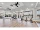 Exercise room with rowing machines, stationary bikes, and large windows offering outdoor views at 3337 Pine Shadow Cir, North Port, FL 34287