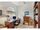 Home office features built-in shelving and custom desk at 3337 Pine Shadow Cir, North Port, FL 34287