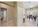 View of tiled hallway with a doorway to a bathroom, and breakfast nook with bay window at 414 Laurel Lake Dr # 203, Venice, FL 34292