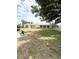Well-maintained building with a manicured lawn and beautiful landscaping at 414 Laurel Lake Dr # 203, Venice, FL 34292