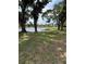 A serene pond view with lush greenery and mature trees provides a peaceful escape at 414 Laurel Lake Dr # 203, Venice, FL 34292