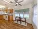 Cozy dining area featuring wood floors, modern furnishings, and scenic views at 423 Pirates Pt, North Port, FL 34287