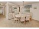 Classic dining room featuring a built-in cabinet, chandelier, and neutral tones at 423 Pirates Pt, North Port, FL 34287
