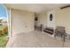 Covered patio area featuring a private entrance and convenient storage at 423 Pirates Pt, North Port, FL 34287