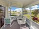Enclosed lanai with beautiful view of the pond and fountain from the sitting area at 423 Pirates Pt, North Port, FL 34287