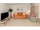 Comfortable living room with a classic sofa, decorative pillows, and ample natural light at 423 Pirates Pt, North Port, FL 34287
