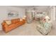 Spacious open-concept living and dining area with ample seating and a ceiling fan at 423 Pirates Pt, North Port, FL 34287