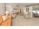 Expansive living area flowing into the dining room, bathed in natural light at 423 Pirates Pt, North Port, FL 34287