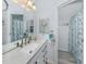 Beautiful bathroom featuring granite countertops, new fixtures, an oversized sink, and a shower at 425 Pirates Pt, North Port, FL 34287