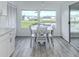 Cozy dining area features a pond view and seating for four at 425 Pirates Pt, North Port, FL 34287