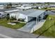 Charming single-story home boasts well-maintained landscaping and a covered carport for convenient parking at 425 Pirates Pt, North Port, FL 34287