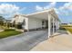 Inviting home featuring a covered carport, offering protection from the elements and convenient access at 425 Pirates Pt, North Port, FL 34287