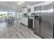 Modern kitchen with stainless steel appliances and a view of the pond at 425 Pirates Pt, North Port, FL 34287