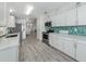 Modern kitchen with open concept to the dining area at 425 Pirates Pt, North Port, FL 34287