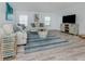 Comfortable living room area, complete with coastal decor and plenty of natural light at 425 Pirates Pt, North Port, FL 34287