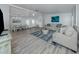 Open-concept living area flowing into the dining space, featuring stylish furnishings at 425 Pirates Pt, North Port, FL 34287