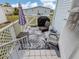 Outdoor deck with grill, seating, and umbrella; ideal for outdoor dining at 443 Landsedge Dr, North Port, FL 34287