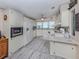Bright kitchen with new flooring, crisp white cabinets, and modern appliances at 443 Landsedge Dr, North Port, FL 34287