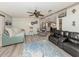 Relaxing living space with couches and chairs, alongside stylish decor, and hardwood floors at 443 Landsedge Dr, North Port, FL 34287