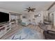Bright living room featuring hardwood floors, couches and chairs, and access to the patio at 443 Landsedge Dr, North Port, FL 34287