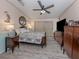 Serene main bedroom with wood-look floors, generous closet space, and natural light at 443 Landsedge Dr, North Port, FL 34287