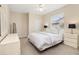 Bright bedroom with neutral tones, ceiling fan, and natural light from window at 4641 Gaeta Dr, Venice, FL 34293