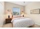 Cozy bedroom with carpet, neutral paint, and a bright window with views of the outdoors at 4641 Gaeta Dr, Venice, FL 34293