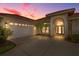 Exterior view of home with driveway, garage, tile roof, and arched front entrance at 4641 Gaeta Dr, Venice, FL 34293