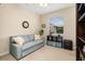 Cozy living room featuring a soft couch, window, and view to the outdoors at 4641 Gaeta Dr, Venice, FL 34293