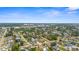 Scenic aerial view capturing a residential neighborhood with a mix of housing styles and community amenities at 511 Porpoise Rd, Venice, FL 34293
