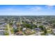 Sprawling neighborhood with tree-lined streets near the ocean under a clear blue sky at 511 Porpoise Rd, Venice, FL 34293