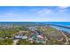 High-angle view showcases local community amenities, beautiful waterways and an ocean view at 511 Porpoise Rd, Venice, FL 34293