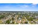 Aerial view of a residential area featuring well-maintained homes and a scenic lake at 511 Porpoise Rd, Venice, FL 34293