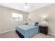 Bedroom featuring a window and two nightstands with lamps at 511 Porpoise Rd, Venice, FL 34293