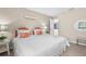Comfortable bedroom with a queen bed and ample natural light at 511 Porpoise Rd, Venice, FL 34293