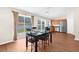 Dining area with table, chairs, and a sliding glass door leading to the backyard at 511 Porpoise Rd, Venice, FL 34293